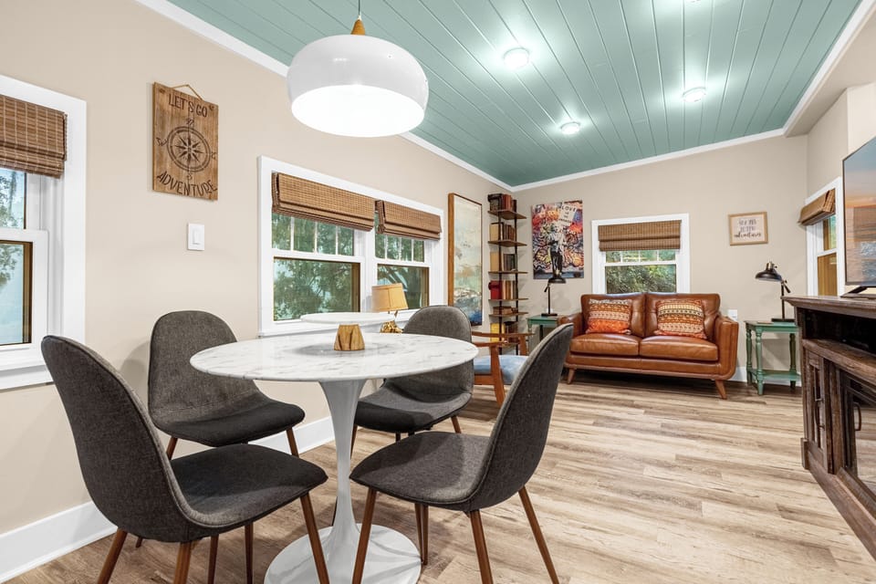 Dining room and family room with large flat screen TV.  