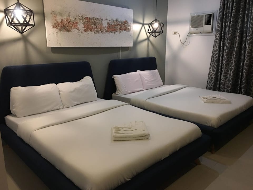 Family Room - Aircon, Private Bathroom | Blackout drapes, soundproofing, rollaway beds, bed sheets