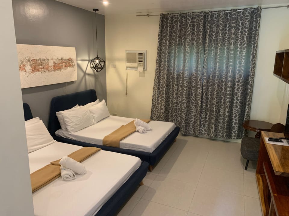Family Room - Aircon, Private Bathroom | Blackout drapes, soundproofing, rollaway beds, bed sheets