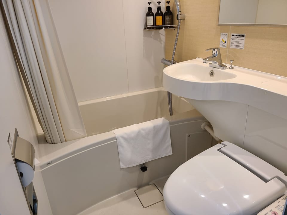 Combined shower/tub, free toiletries, hair dryer, bathrobes