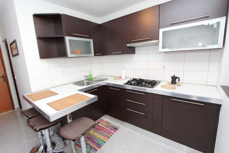 Apartment, 1 Bedroom | Private kitchen | Fridge, microwave, stovetop, coffee/tea maker