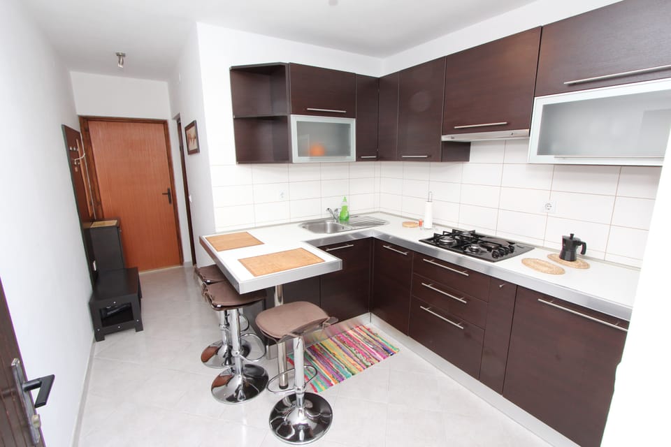 Apartment, 1 Bedroom | Private kitchen | Fridge, microwave, stovetop, coffee/tea maker