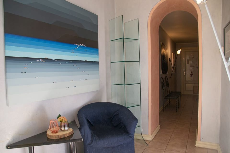 Apartment, 1 Bedroom, Lake View | Living area | Flat-screen TV