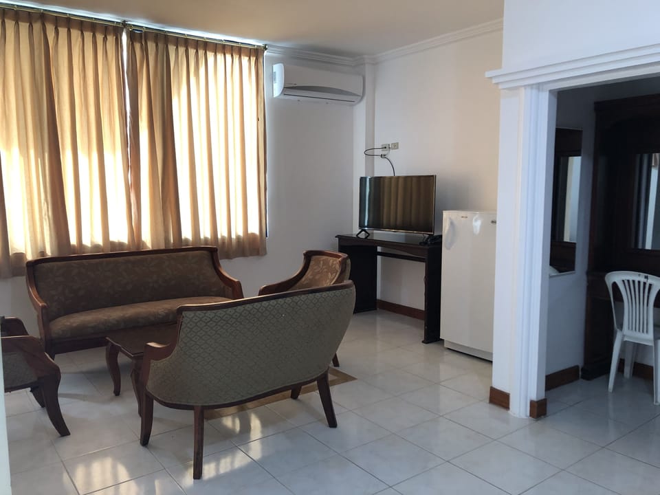Junior Suite, 1 Queen Bed, City View | Iron/ironing board (on request), WiFi (free), bed sheets