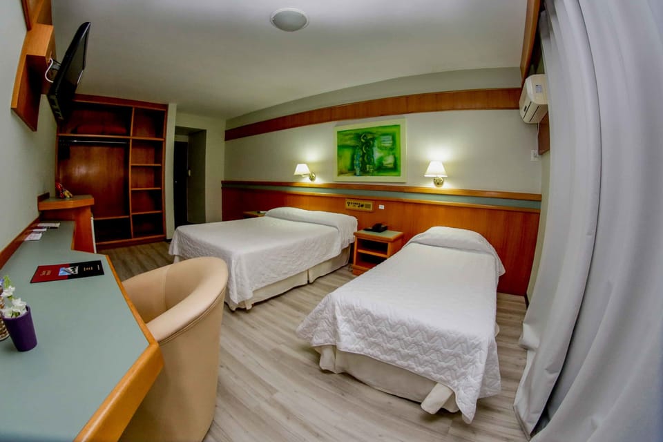 Deluxe Apartment (Triple) | Minibar, in-room safe, desk, laptop workspace