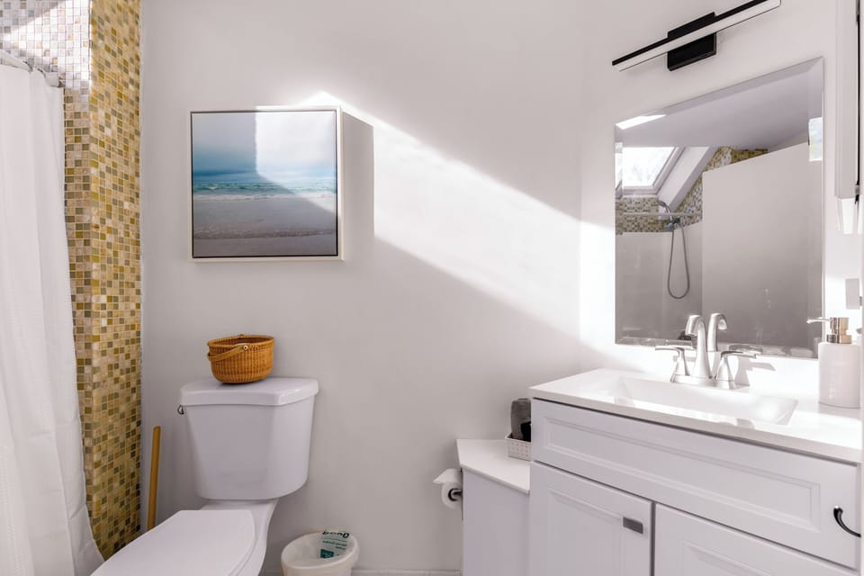 Second floor bathroom with new vanity and sink.

