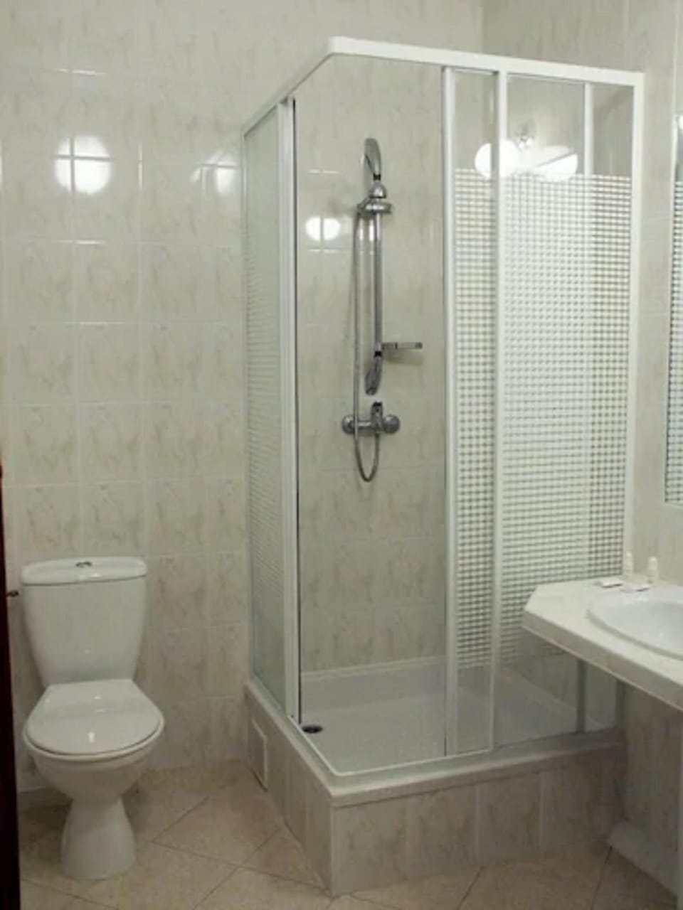 Shower, rainfall showerhead, hair dryer, towels