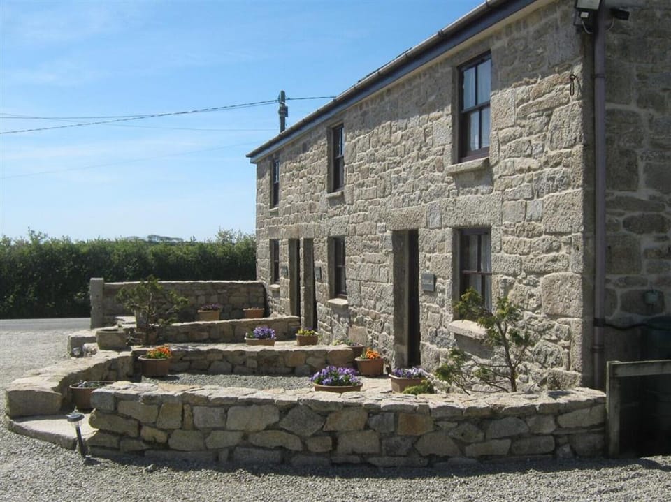 Rear view of property and garden