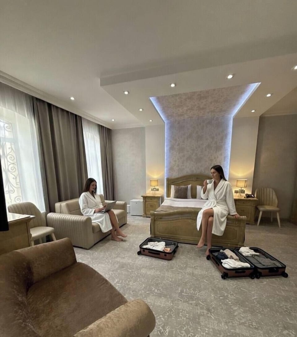 Deluxe Quadruple Room | Premium bedding, pillowtop beds, in-room safe, individually decorated