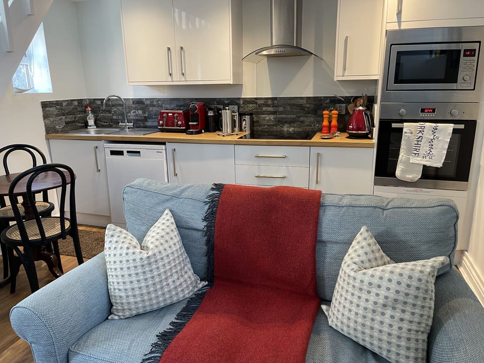 Artists' Loft Hornbeam Park | Living area | 24-inch flat-screen TV with cable channels, Smart TV, fireplace