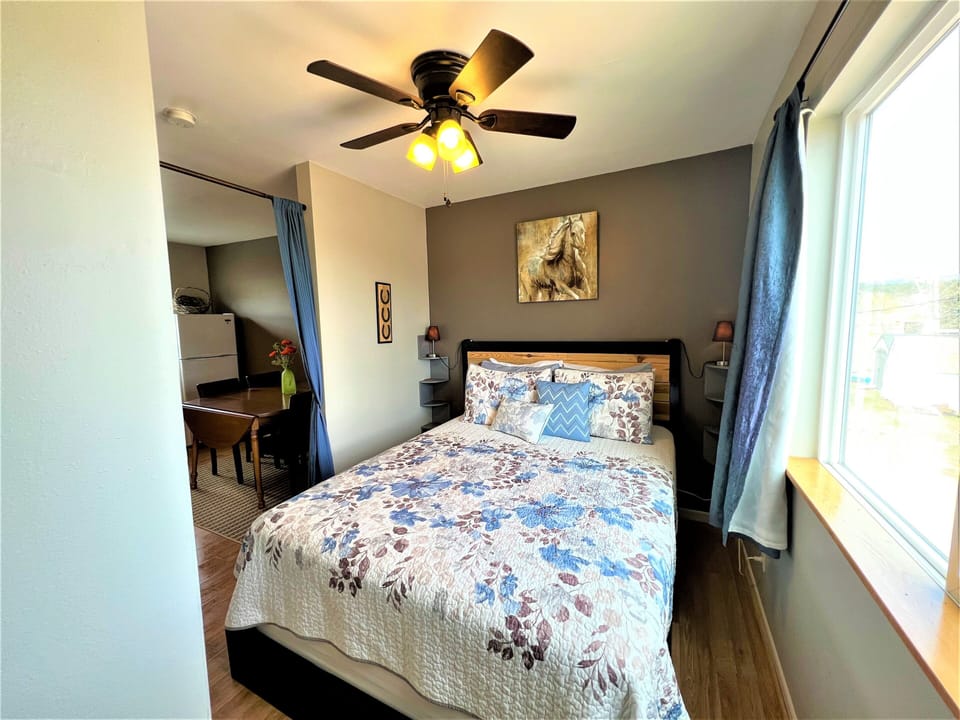 Queen bedroom with AC unit