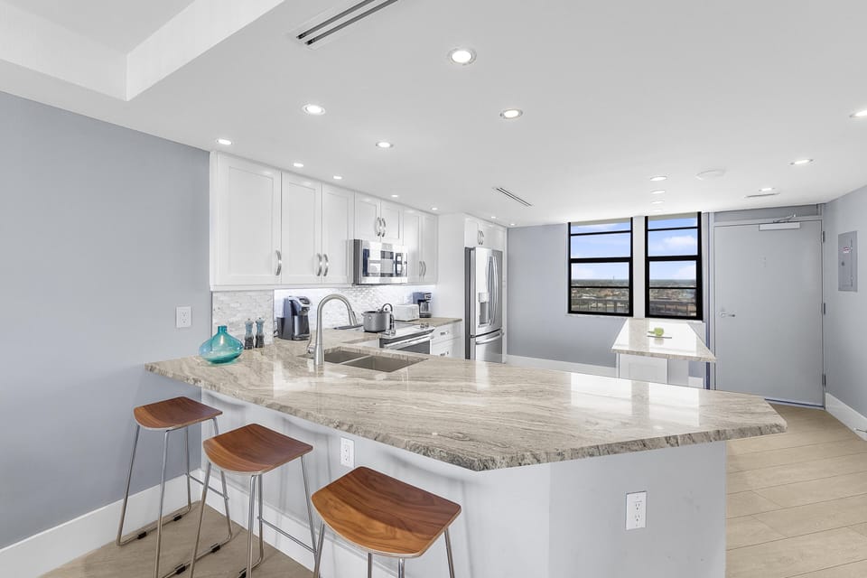 Condo, 1 King Bed with Sofa bed (Elegant beachfront condo in private c) | Private kitchen | Fridge, microwave, oven, stovetop