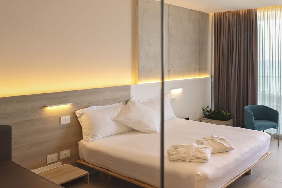 Premium bedding, down comforters, memory foam beds, minibar