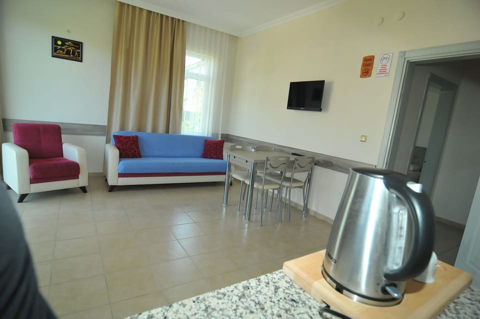 Standard Condo | Living room | Flat-screen TV