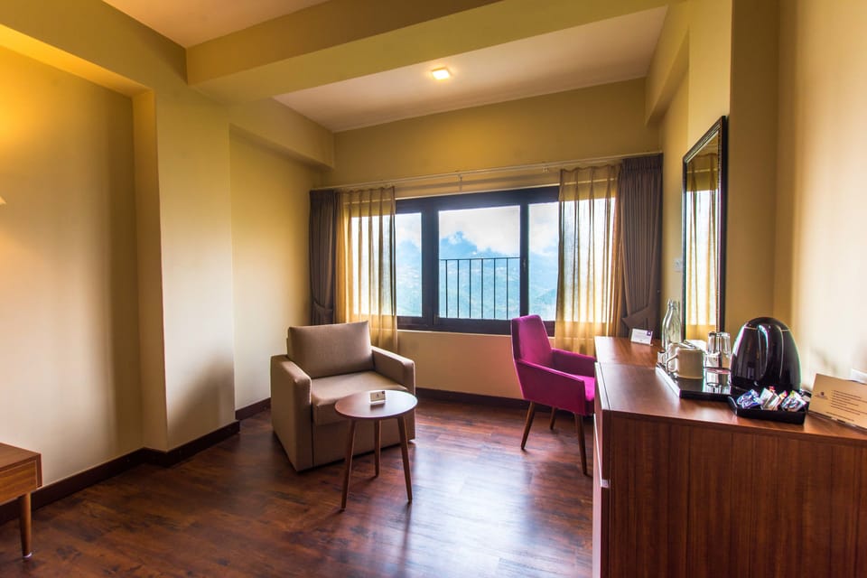 Suite, 1 Queen Bed | Living area | LED TV