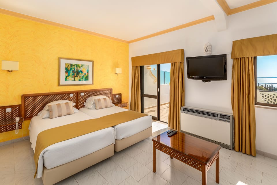 Junior Suite | Minibar, desk, blackout drapes, iron/ironing board