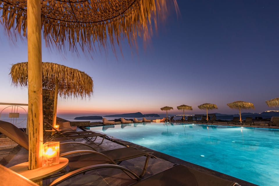 Seasonal outdoor pool, open 9:00 AM to 10:00 PM, pool umbrellas