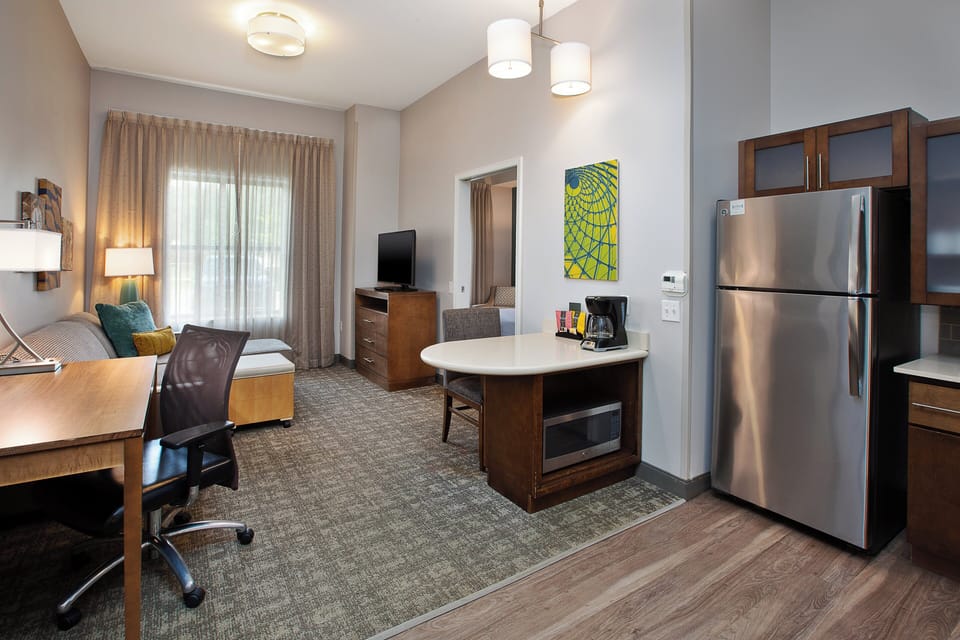 Desk, laptop workspace, blackout drapes, iron/ironing board