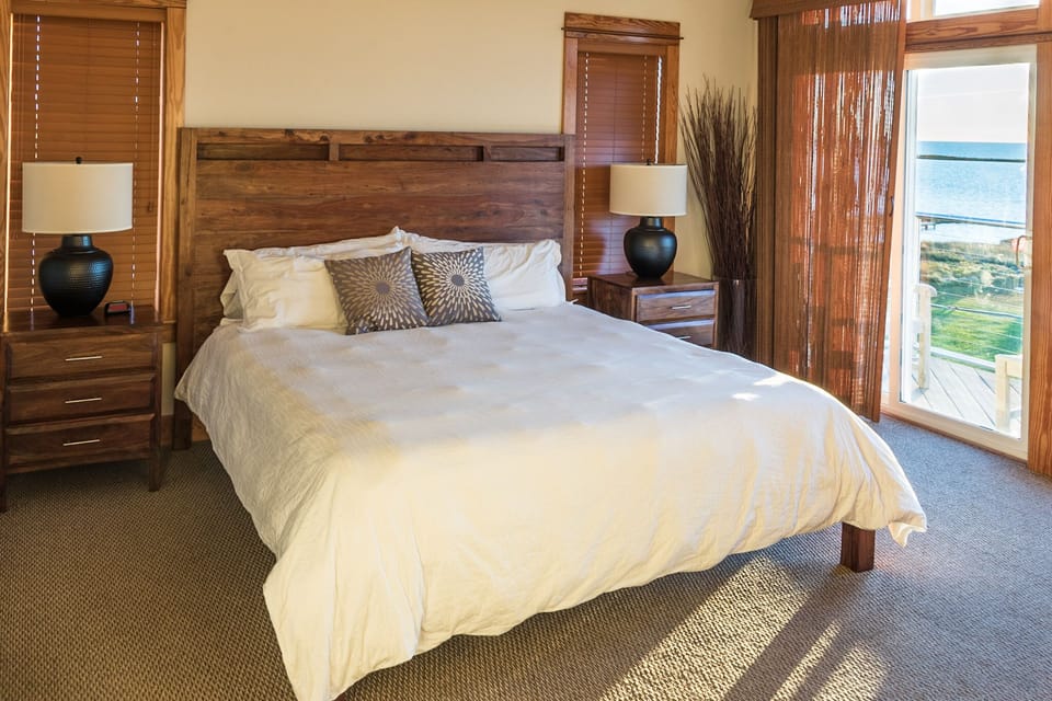 Master Bedroom with Water Front Balcony Access & Private Bathroom