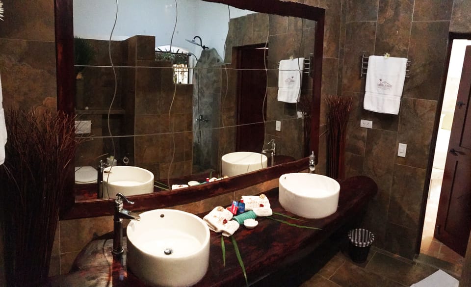 Family Suite, Multiple Beds, Non Smoking, Garden View | Bathroom | Shower, free toiletries, towels, soap