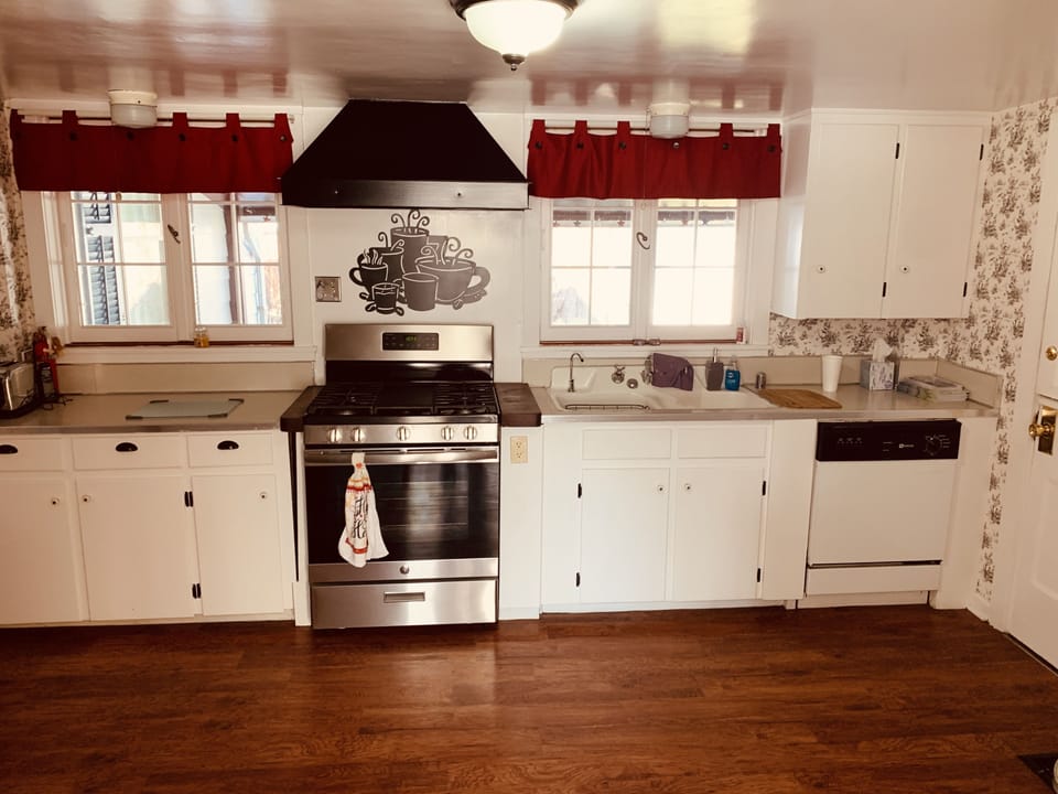 Full-size fridge, microwave, cookware/dishes/utensils