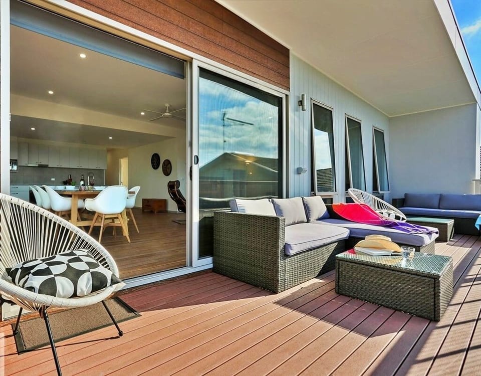 Deck area sun umbrellas & lounges to soak up the stunning view