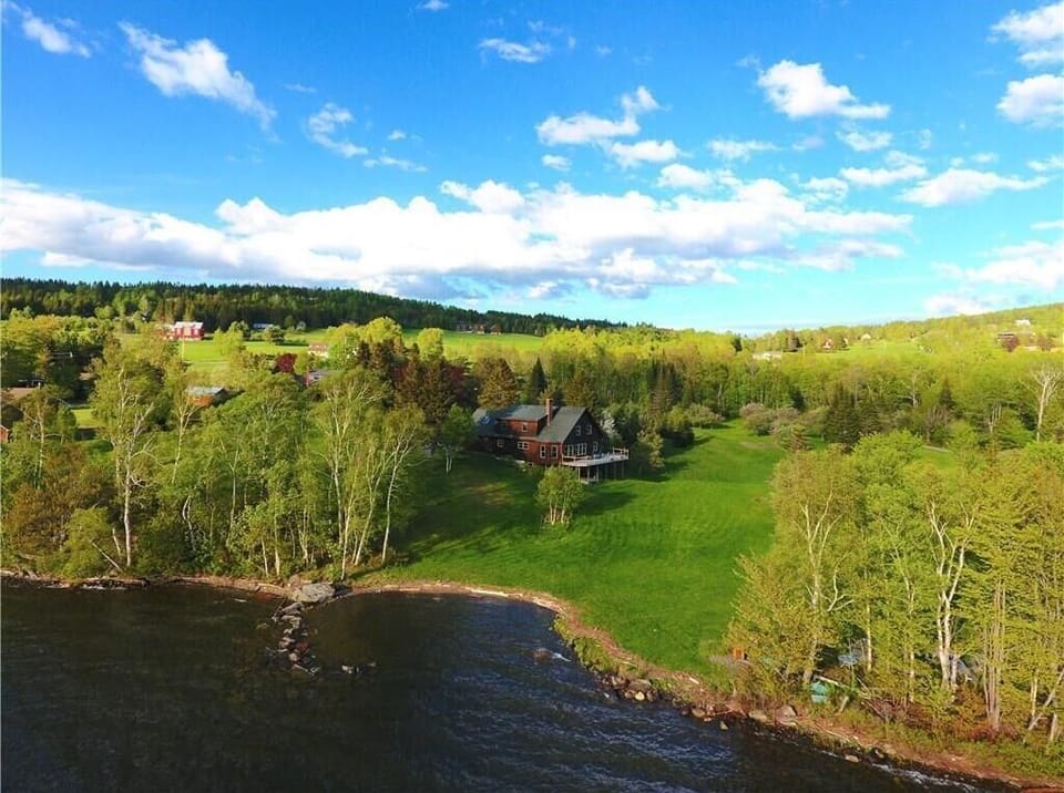 Aerial view of house - waterfront shown belongs to the property