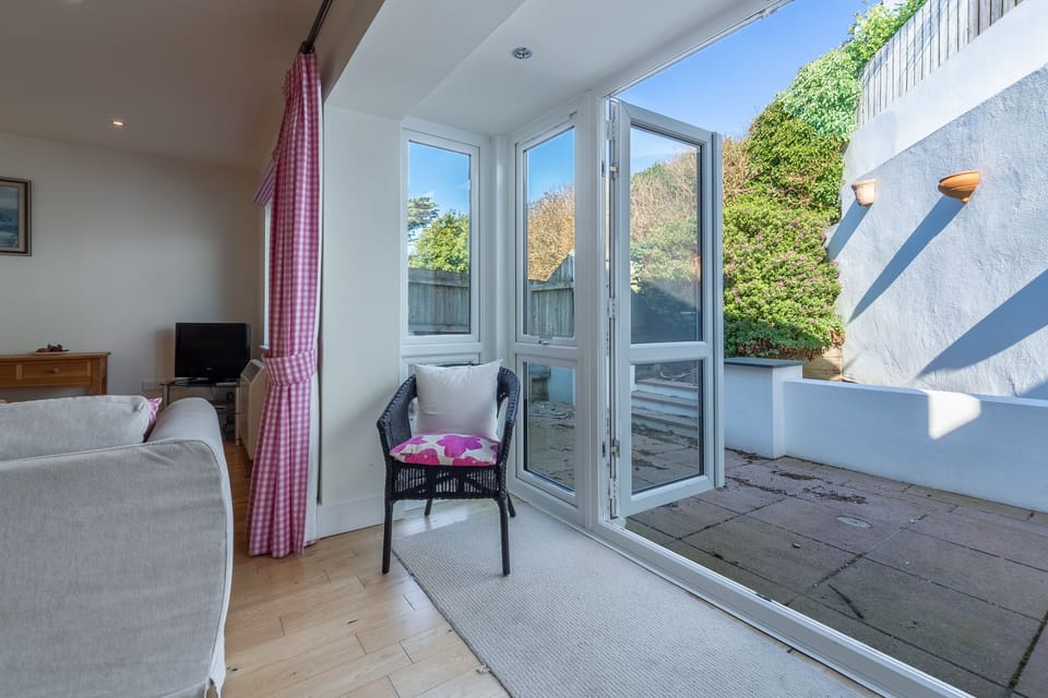 Ground floor:  Open-plan sitting room opening to the patio