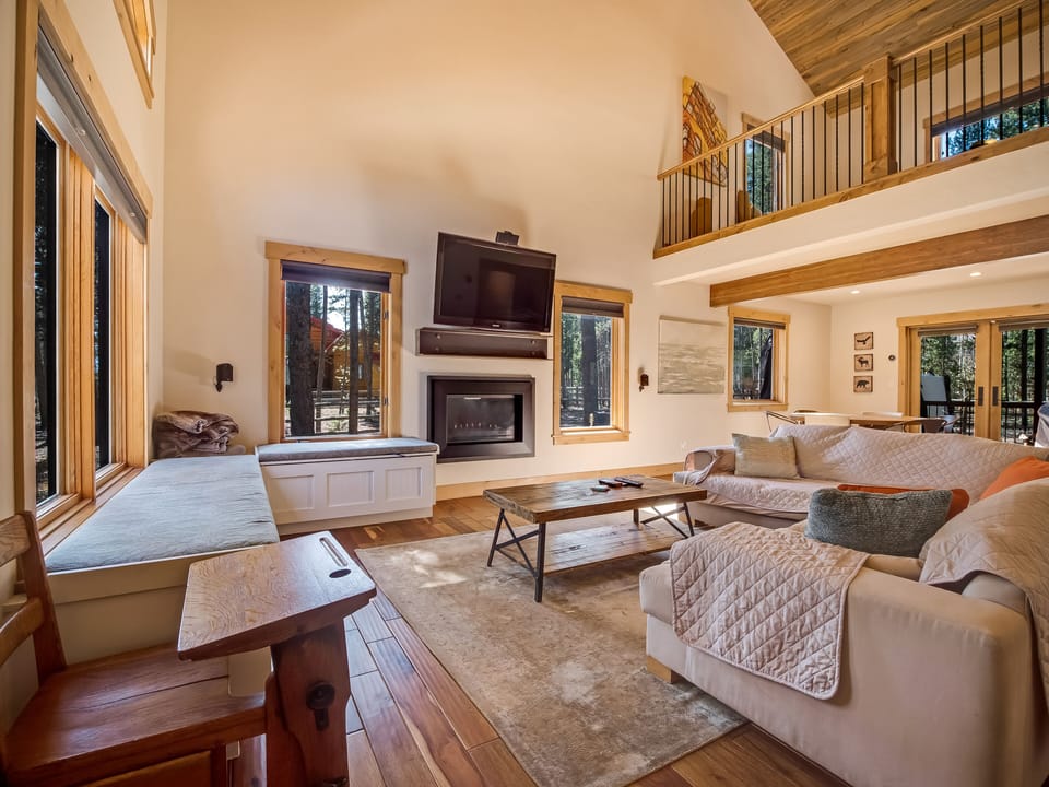 Living room boasts a flat screen TV with 5.1 surround sound and Roku streaming