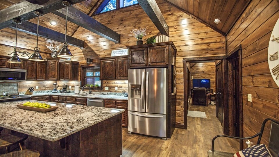 Kitchen Area with view into Den with convenient 1/2 bath on the right