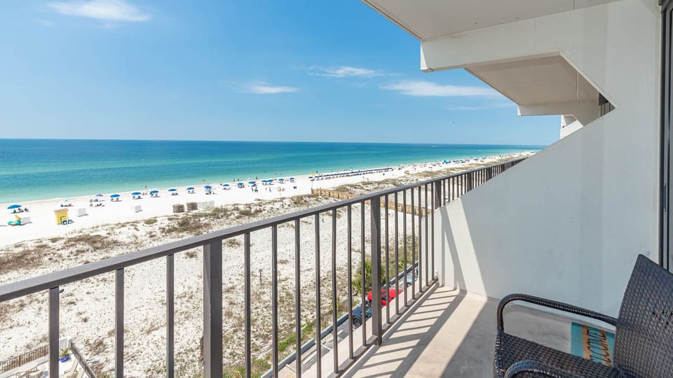 Enjoy stunning beachfront views from this inviting balcony, perfect for relaxing and soaking in the coastal atmosphere