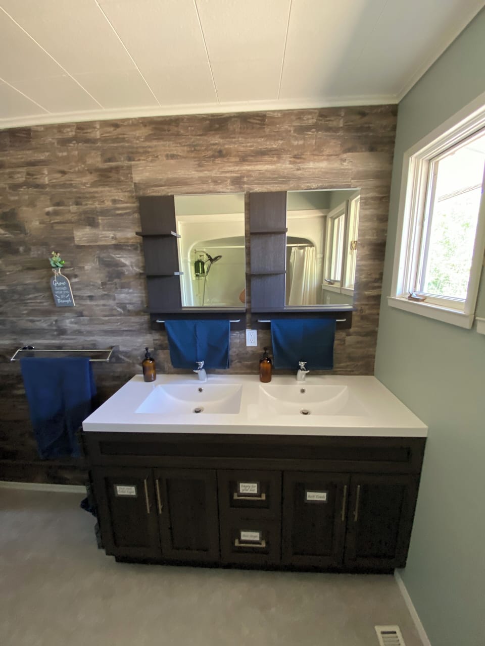 Vanity has double sinks, hair dryer, foot stool, bath/hand towels, face cloths.