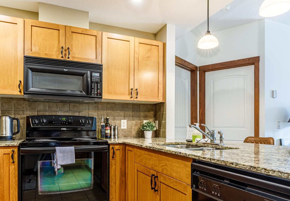 Fancy cooking? This kitchen has everything you need to cook a gourmet meal, including condiments, olive oil, herbs and spices