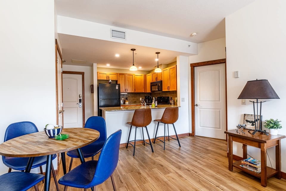 Fully equipped kitchen connected to the dining area.