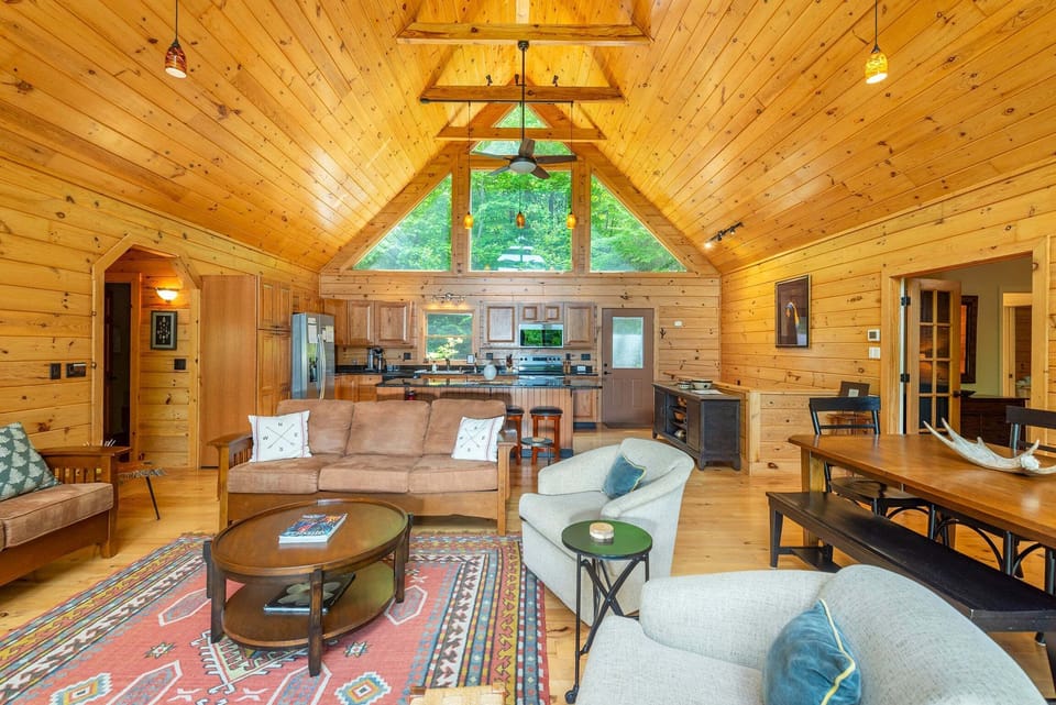 Open floor plan with kitchen, dining, and living area.