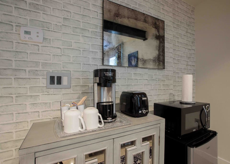 kitchenette includes: coffee maker, toaster, fridge, microwave