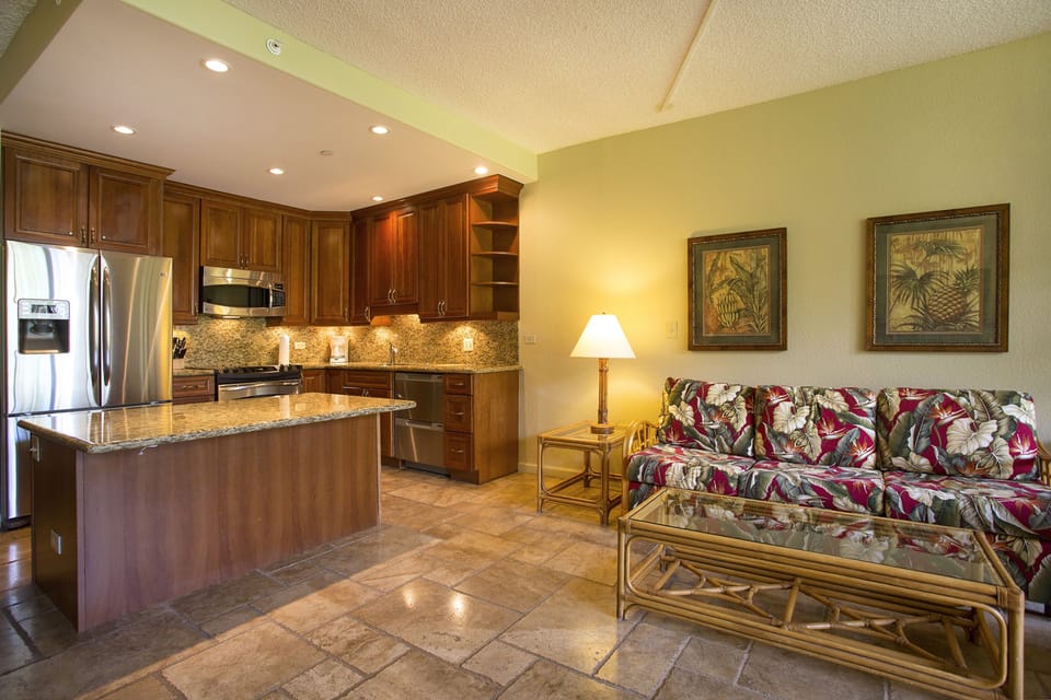 Settle in and make yourself at home in this inviting tropical-themed space, where the open kitchen invites your culinary adventures and the cozy living area beckons for relaxation after island exploring.