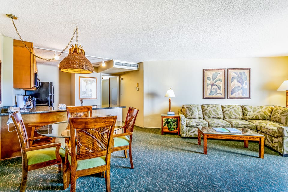 Your spacious island-style retreat features a fully equipped kitchen, cozy dining area, and tropical-themed living room—perfect for unwinding after a day of island adventures.