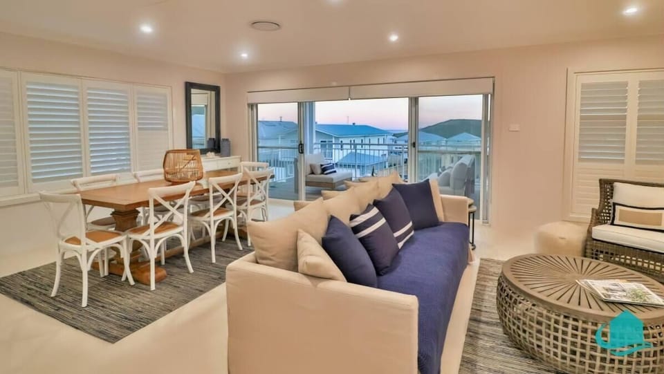 Lounge room upstairs leading on to deck