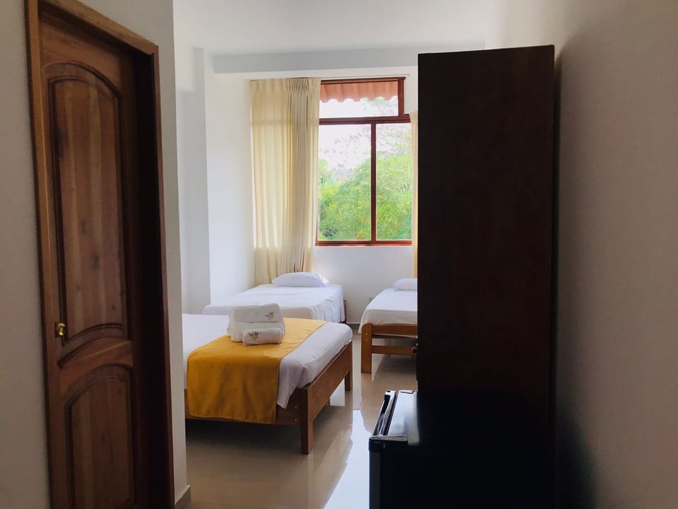 Family Triple Room, Multiple Beds (Air Conditioner) | Minibar, in-room safe, free WiFi, bed sheets