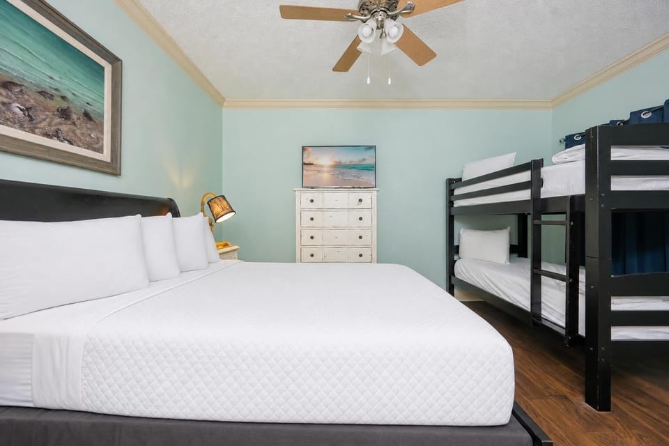 The guest suite with a queen bed and twin bunk beds invites restful sleep and evening movie nights together