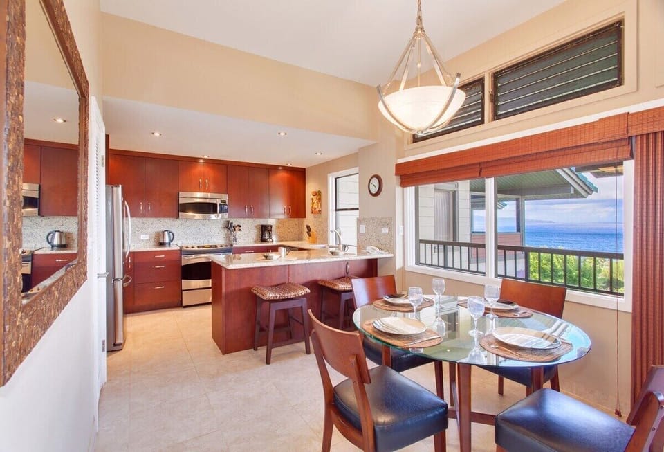The dining area features seating for four