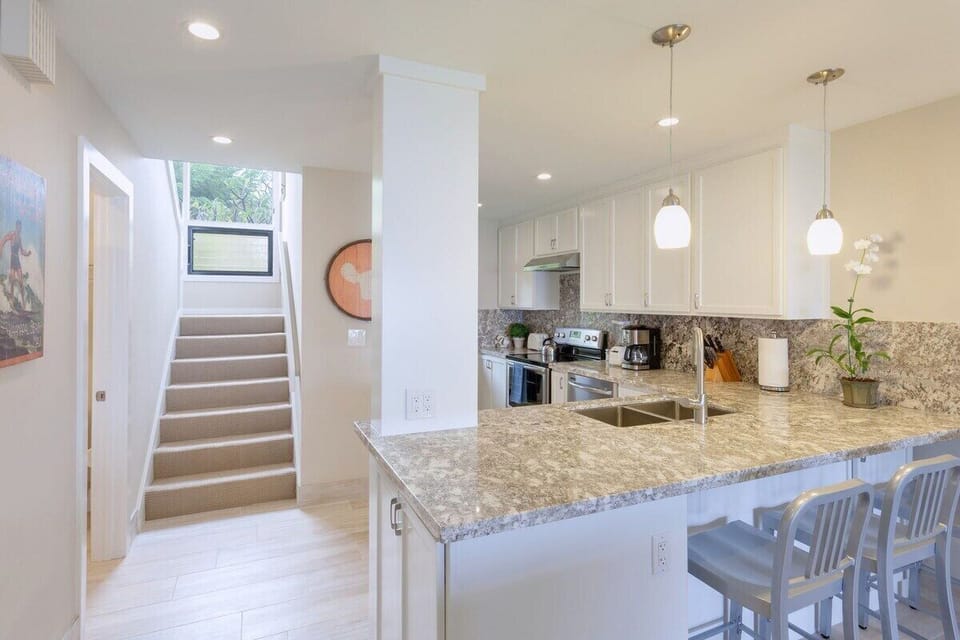 The breakfast bar and open kitchen offers an upscale space to create fabulous meals together