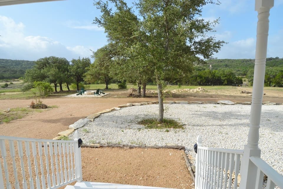 Enjoy Hill Country views from the front porch of Yellow Rose. Miles of trails are just outside your front door, waiting to be explored.