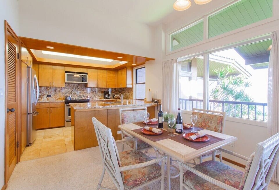 The dining table sits up to four people and features beautiful ocean views