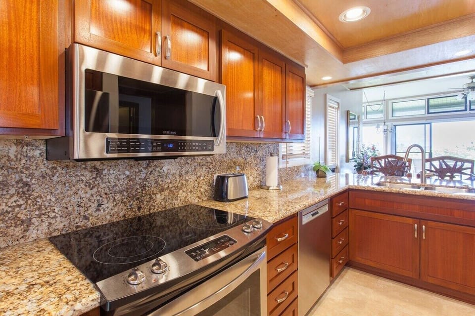 Custom crafted kitchen cabinets and ocean views from the sink