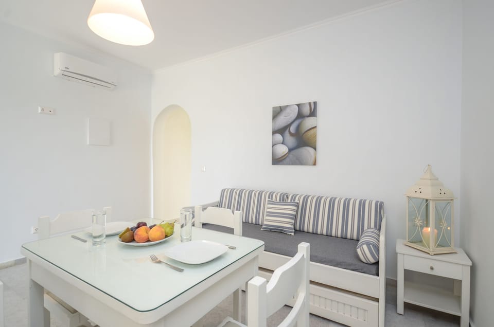 Deluxe Apartment | Living area | 24-cm Smart TV with satellite channels, TV