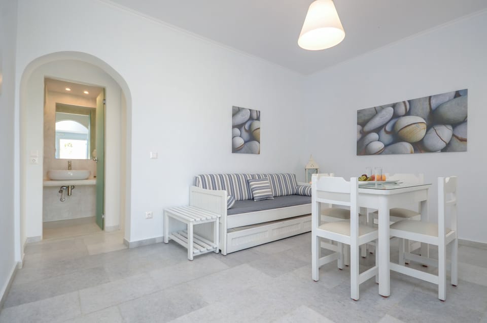 Deluxe Apartment | Living area | 24-cm Smart TV with satellite channels, TV