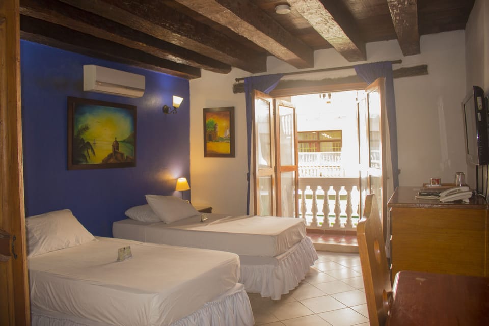 Standard Triple Room, 1 Bedroom, Patio | Minibar, in-room safe, blackout drapes, soundproofing