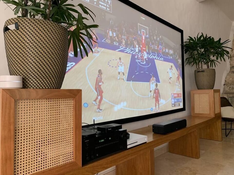 106" HD projector with PlayStation 5 and Bluetooth system.